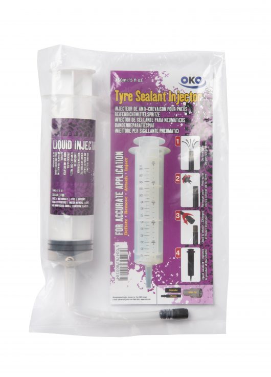OKO 150ml tyre sealant injector syringe with Presta/Schräder screw fitting next to purple OKO branded syringe packaging
