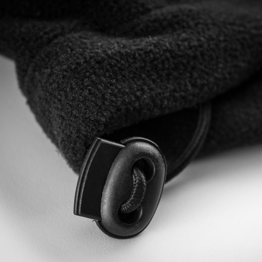 Close up of the black elasticated toggle on at the hem of the Scruffs worker fleece